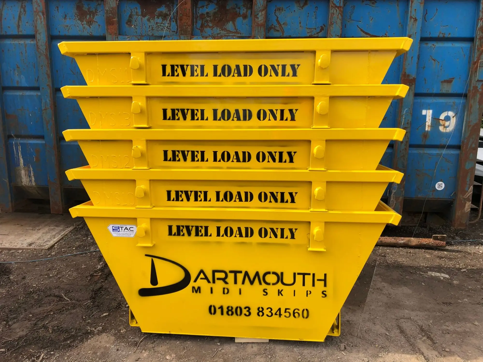 Stack of yellow 2 yard mini skips Dartmouth Midi Skips yard Dartmouth